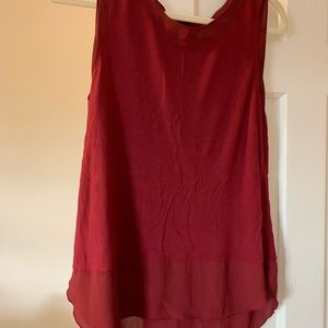 Sleeveless red blouse